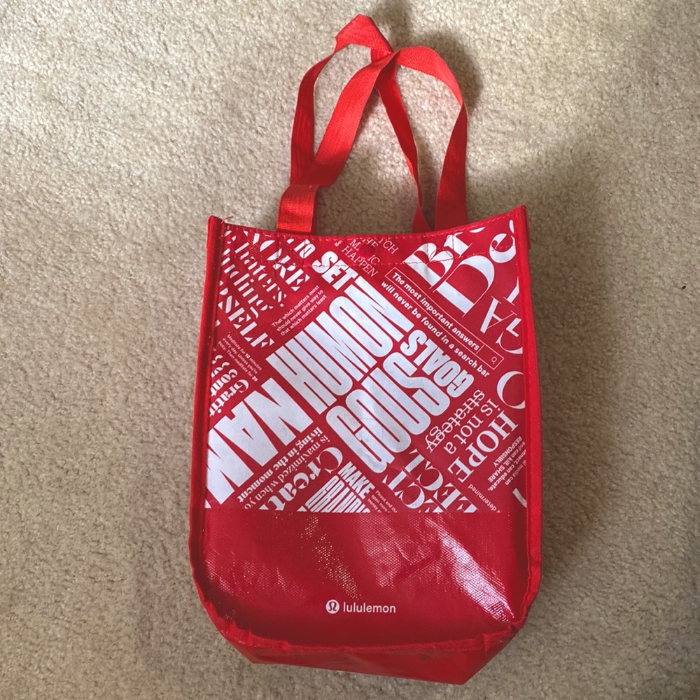 Red and white lululemon tote bag